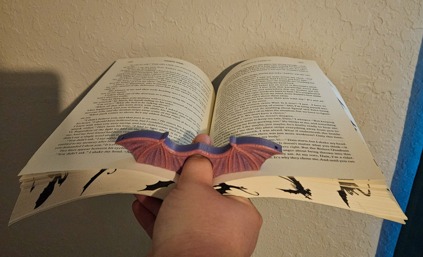 Bat wing page holder